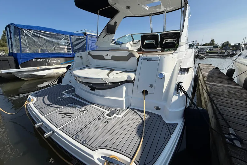  Yacht Photos Pics 2018 Monterey 355 Sport Yacht docked at marina, showcasing sleek design and spacious deck.