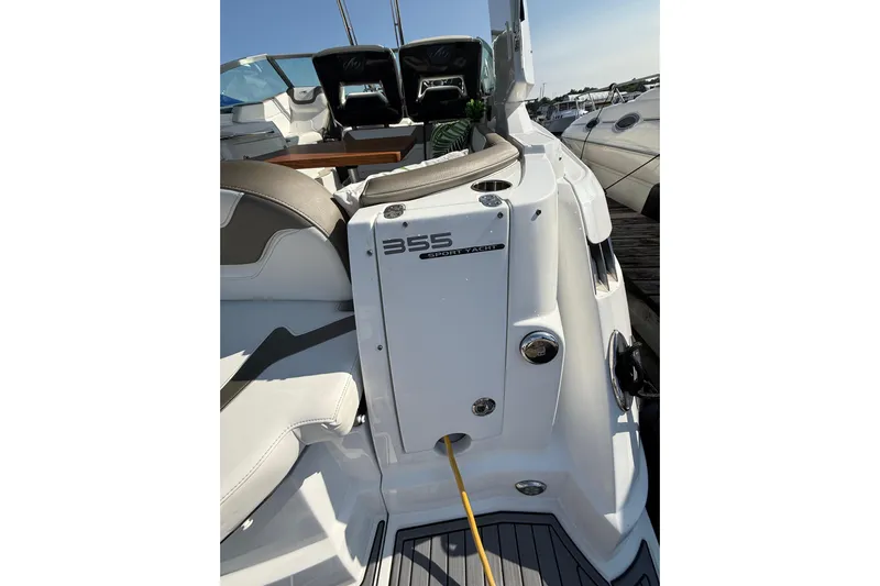  Yacht Photos Pics 2018 Monterey 355 Sport Yacht interior with seating and control panel.