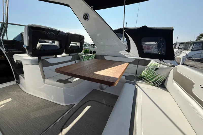  Yacht Photos Pics 2018 Monterey 355 Sport Yacht interior with seating, wooden table, and modern design.