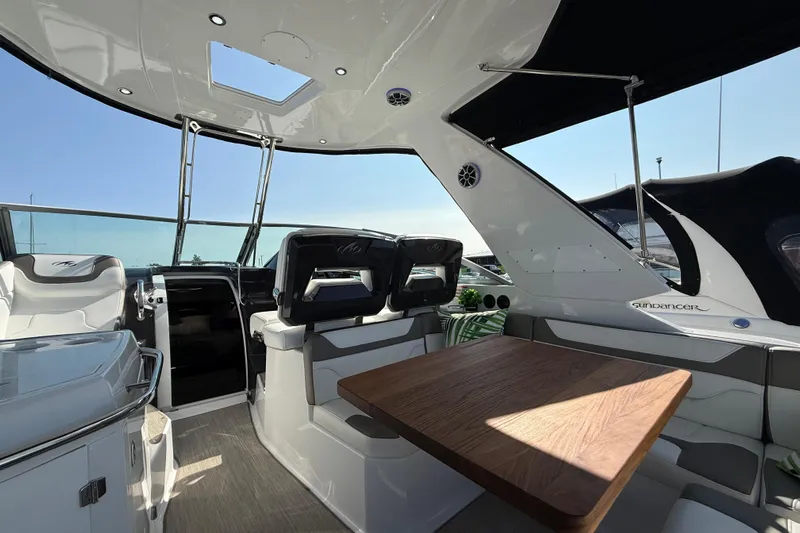  Yacht Photos Pics Interior of 2018 Monterey 355 Sport Yacht with seating and wooden table.