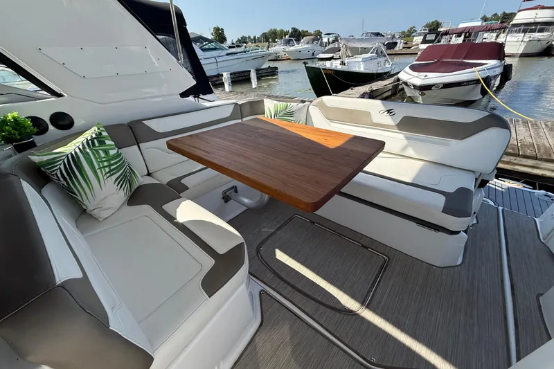  Yacht Photos Pics Luxurious seating area on a 2018 Monterey 355 Sport Yacht, docked at a marina.