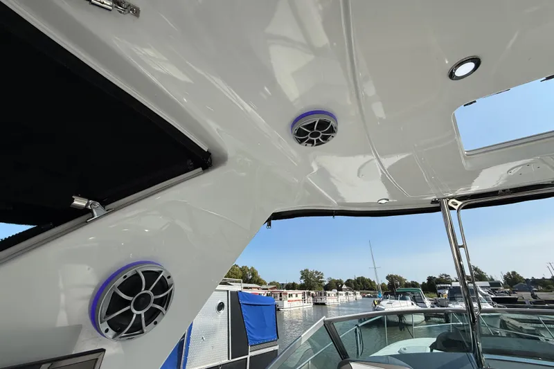  Yacht Photos Pics 2018 Monterey 355 Sport Yacht interior with speakers and marina view.