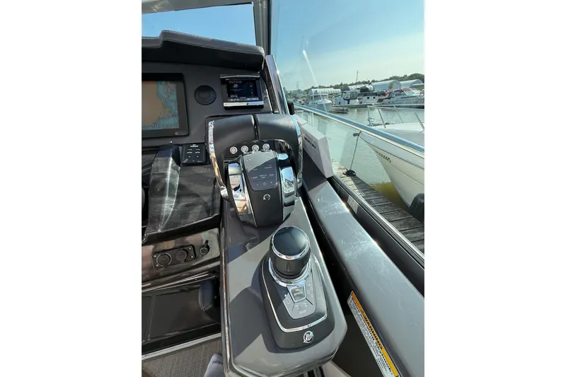  Yacht Photos Pics Control panel of a 2018 Monterey 355 Sport Yacht, docked at a marina.