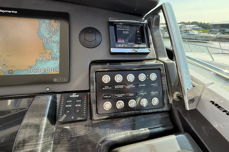  Yacht Photos Pics Control panel of a 2018 Monterey 355 Sport Yacht with navigation and system controls.