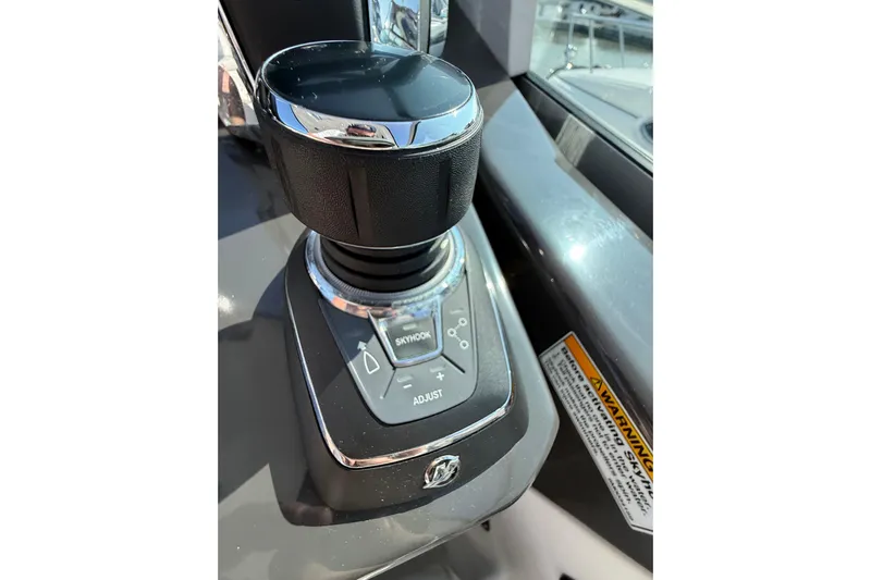  Yacht Photos Pics Joystick control on 2018 Monterey 355 Sport Yacht dashboard, featuring Skyhook and adjust buttons.