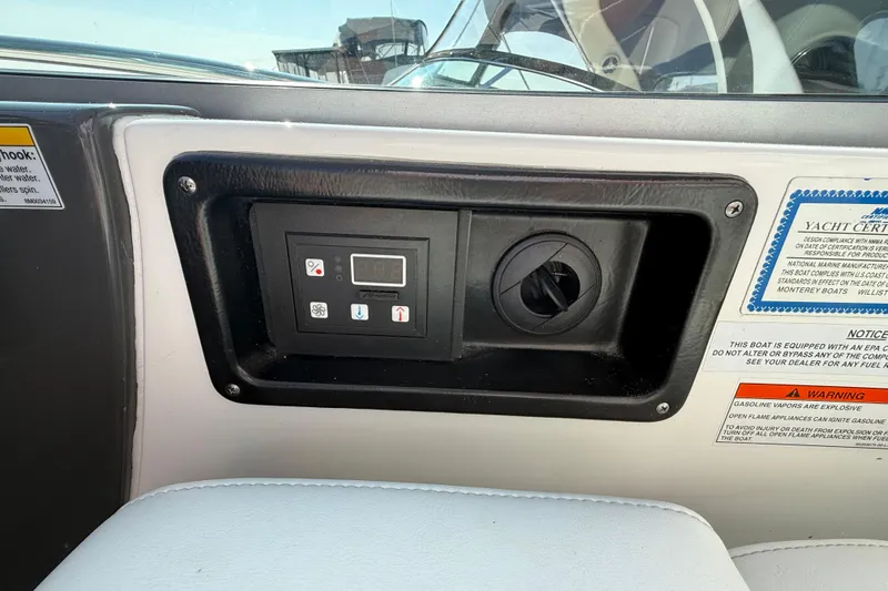  Yacht Photos Pics Control panel on a 2018 Monterey 355 Sport Yacht dashboard with warning labels.