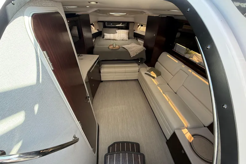  Yacht Photos Pics Interior of 2018 Monterey 355 Sport Yacht, featuring modern seating and cozy sleeping area.