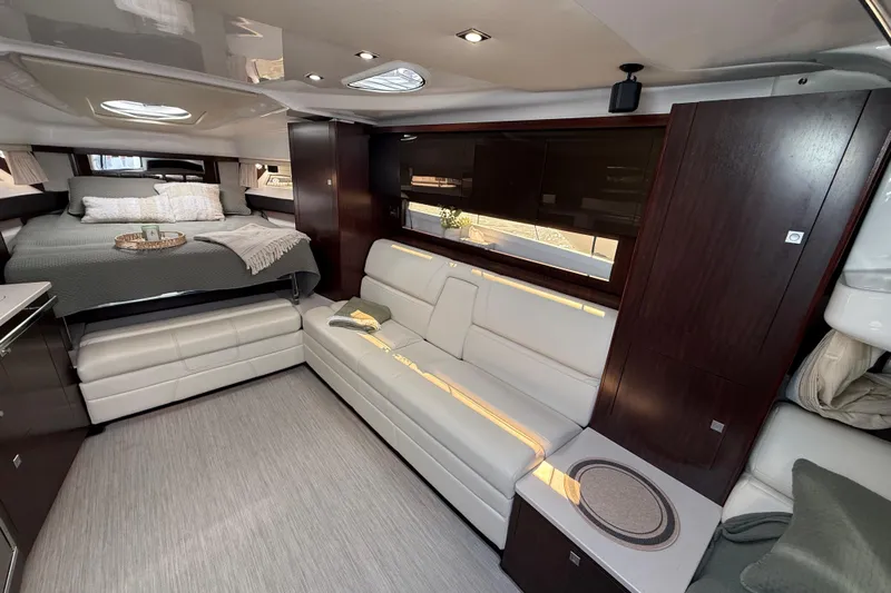  Yacht Photos Pics Luxurious interior of 2018 Monterey 355 Sport Yacht with elegant seating and cozy bed.