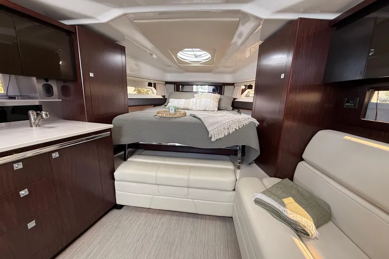  Yacht Photos Pics Luxurious interior of 2018 Monterey 355 Sport Yacht with cozy bed and modern amenities.