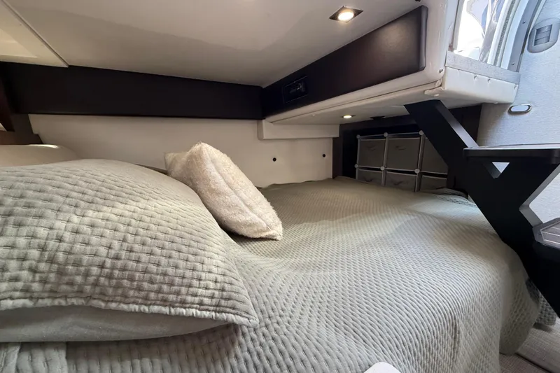  Yacht Photos Pics Cozy cabin interior of 2018 Monterey 355 Sport Yacht with plush bedding and modern lighting.