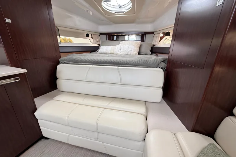  Yacht Photos Pics Luxurious interior of 2018 Monterey 355 Sport Yacht with elegant bedding and seating.