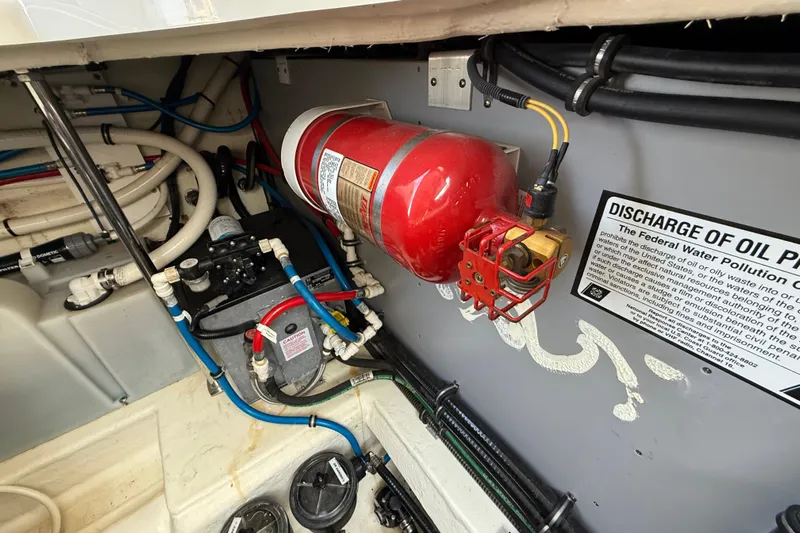  Yacht Photos Pics Engine compartment of 2018 Monterey 355 Sport Yacht with fire extinguisher and discharge warning sign.