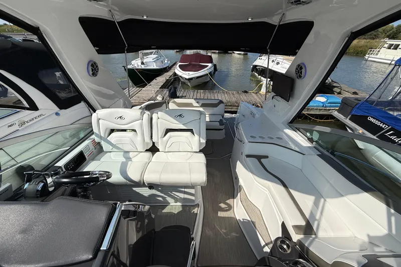  Yacht Photos Pics 2018 Monterey 355 Sport Yacht interior with seating, docked at marina.