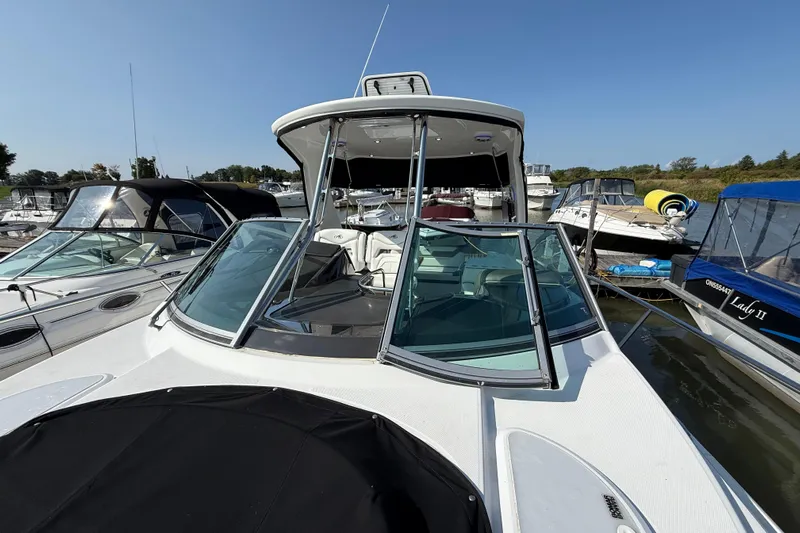  Yacht Photos Pics 2018 Monterey 355 Sport Yacht docked among other boats on a sunny day.