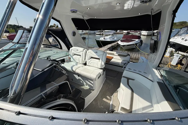  Yacht Photos Pics 2018 Monterey 355 Sport Yacht interior with luxurious seating at a marina.