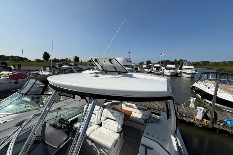  Yacht Photos Pics 2018 Monterey 355 Sport Yacht docked at marina under clear blue sky.