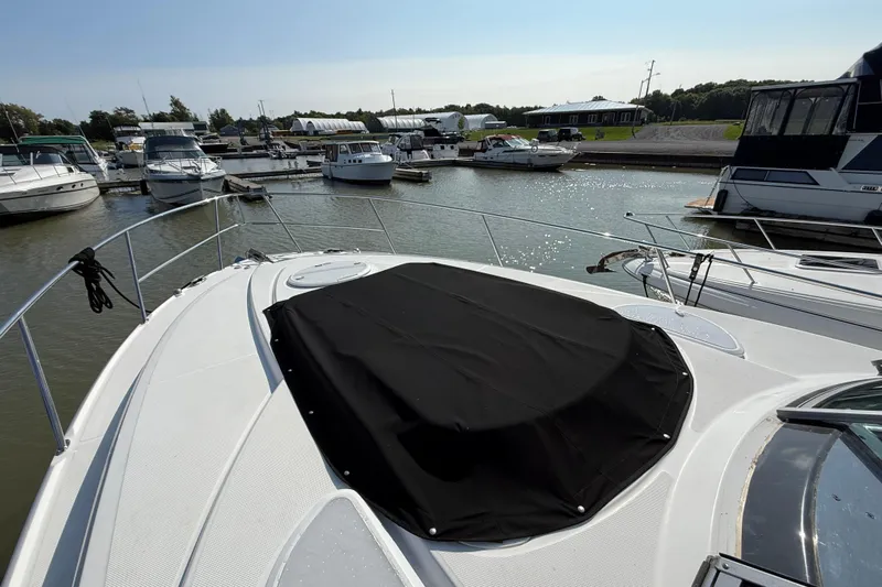  Yacht Photos Pics 2018 Monterey 355 Sport Yacht docked in a marina, covered bow, sunny day.