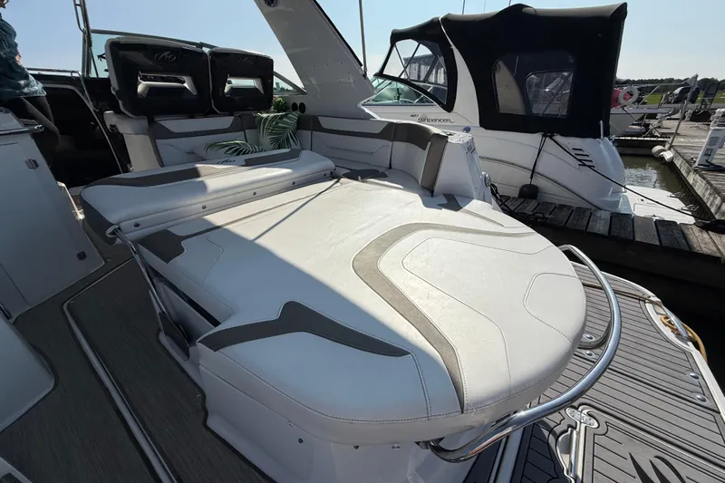  Yacht Photos Pics 2018 Monterey 355 Sport Yacht with luxurious seating and sleek design at a marina.