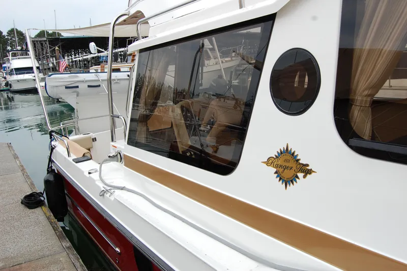  Yacht Photos Pics 2018 Ranger Tugs R29 boat docked at marina, side view with logo visible.