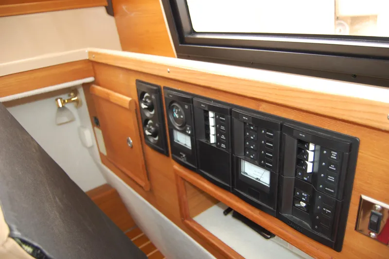  Yacht Photos Pics 2018 Ranger Tugs R29 interior control panel with wood finish and switches.