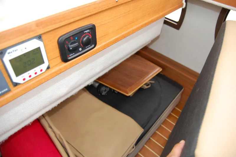  Yacht Photos Pics 2018 Ranger Tugs R29 interior storage with control panels and wooden flooring.