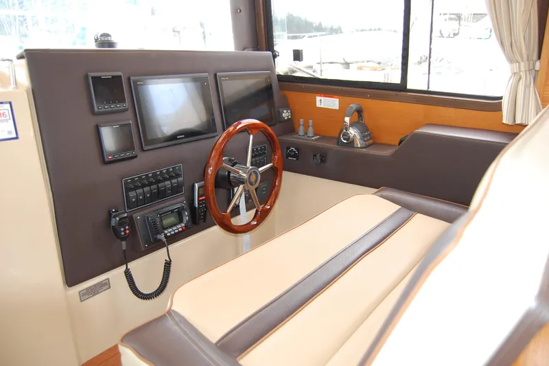  Yacht Photos Pics 2018 Ranger Tugs R29 helm with modern navigation equipment and comfortable seating.