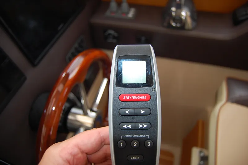  Yacht Photos Pics Remote control for 2018 Ranger Tugs R29 boat, near wooden steering wheel.
