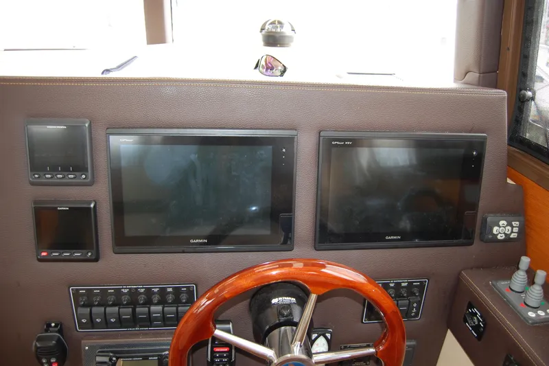  Yacht Photos Pics 2018 Ranger Tugs R29 helm with Garmin displays and wooden steering wheel.