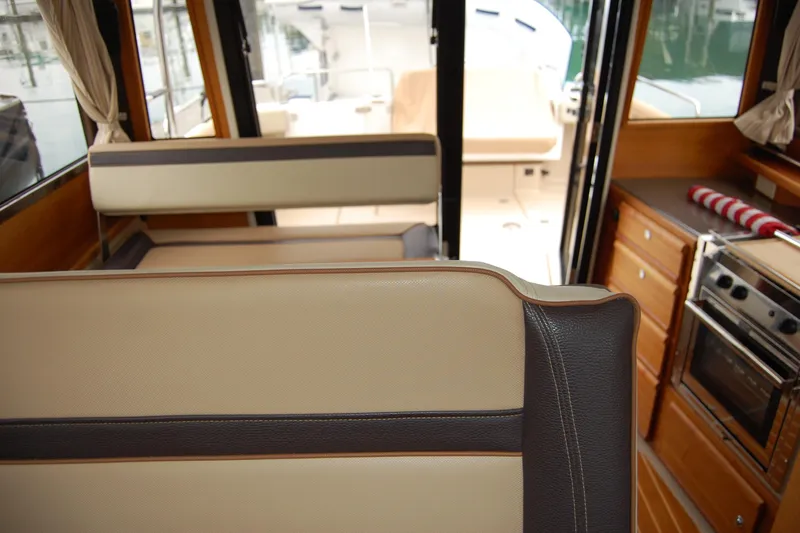  Yacht Photos Pics Interior of 2018 Ranger Tugs R29 boat with seating and kitchen area.