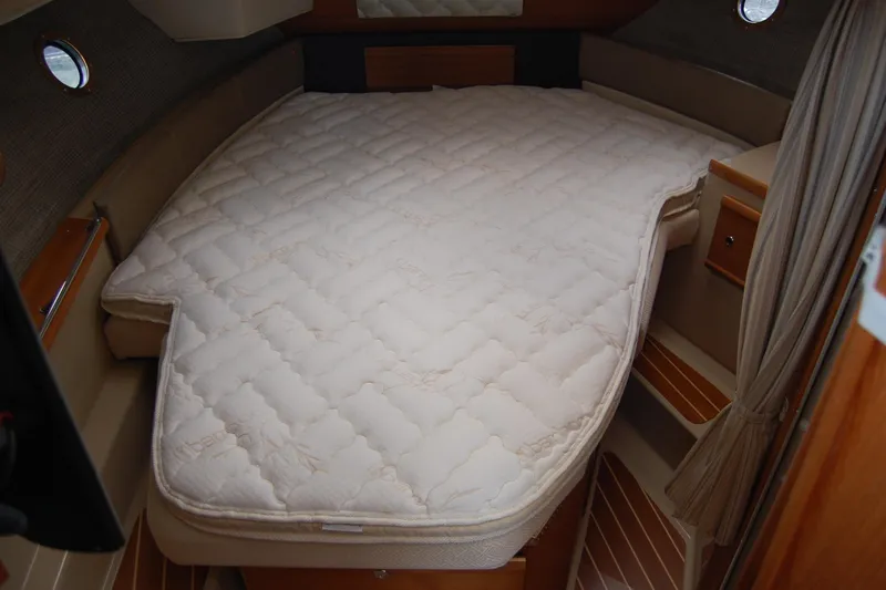  Yacht Photos Pics 2018 Ranger Tugs R29 cabin interior with a cozy bed setup.