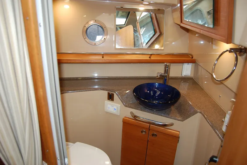  Yacht Photos Pics 2018 Ranger Tugs R29 bathroom with modern sink and porthole window.