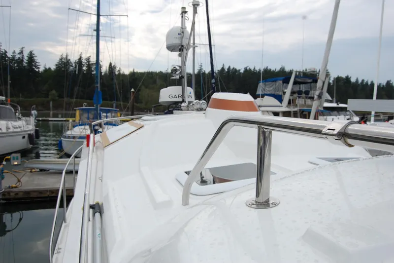  Yacht Photos Pics 2018 Ranger Tugs R29 boat docked, featuring sleek design and stainless steel railings.