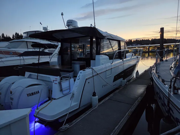  Yacht Photos Pics 2023 Jeanneau NC Weekender 1095 docked at sunset with Yamaha engines.