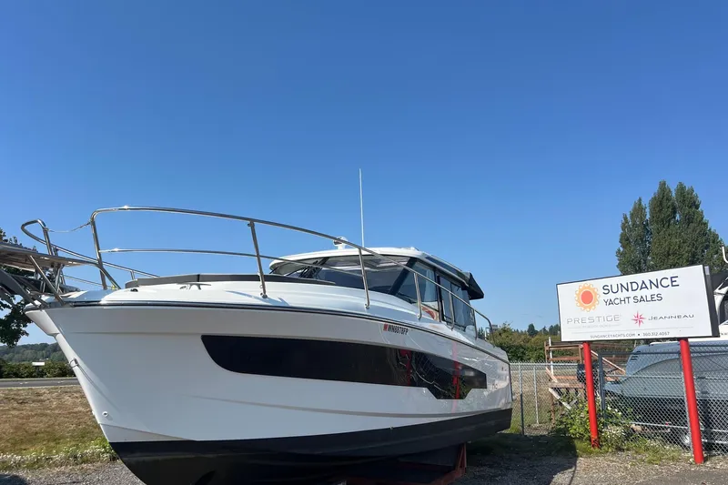  Yacht Photos Pics 2023 Jeanneau NC Weekender 1095 at Sundance Yacht Sales under clear blue sky.