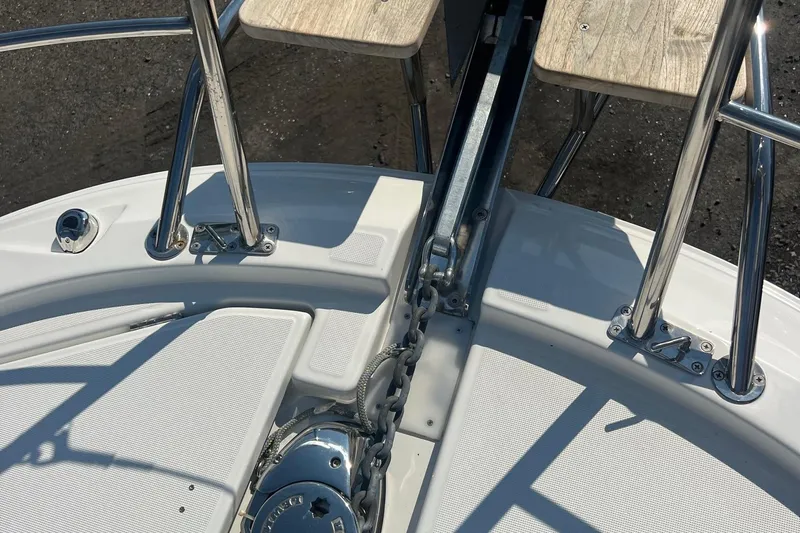  Yacht Photos Pics 2023 Jeanneau NC Weekender 1095 boat deck with anchor chain and stainless steel fittings.