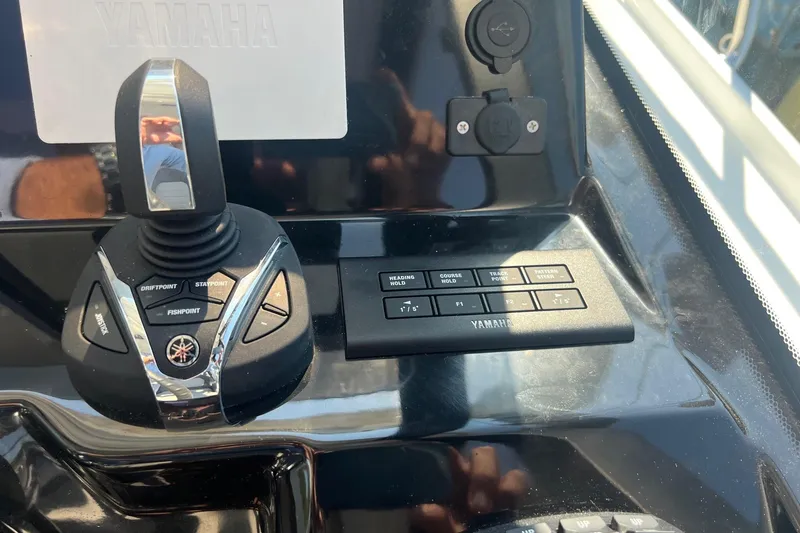 Yacht Photos Pics Control panel of 2023 Jeanneau NC Weekender 1095 with Yamaha joystick and buttons.