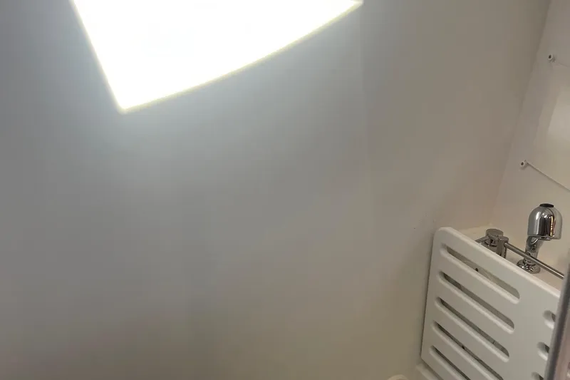  Yacht Photos Pics Interior of 2023 Jeanneau NC Weekender 1095, featuring a sleek, modern bathroom design.