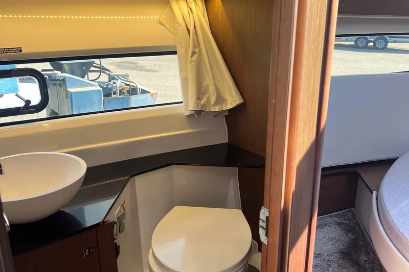 Yacht Photos Pics 2023 Jeanneau NC Weekender 1095 interior bathroom with sink and toilet.
