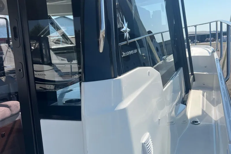  Yacht Photos Pics 2023 Jeanneau NC Weekender 1095 boat exterior with sleek design and modern features.