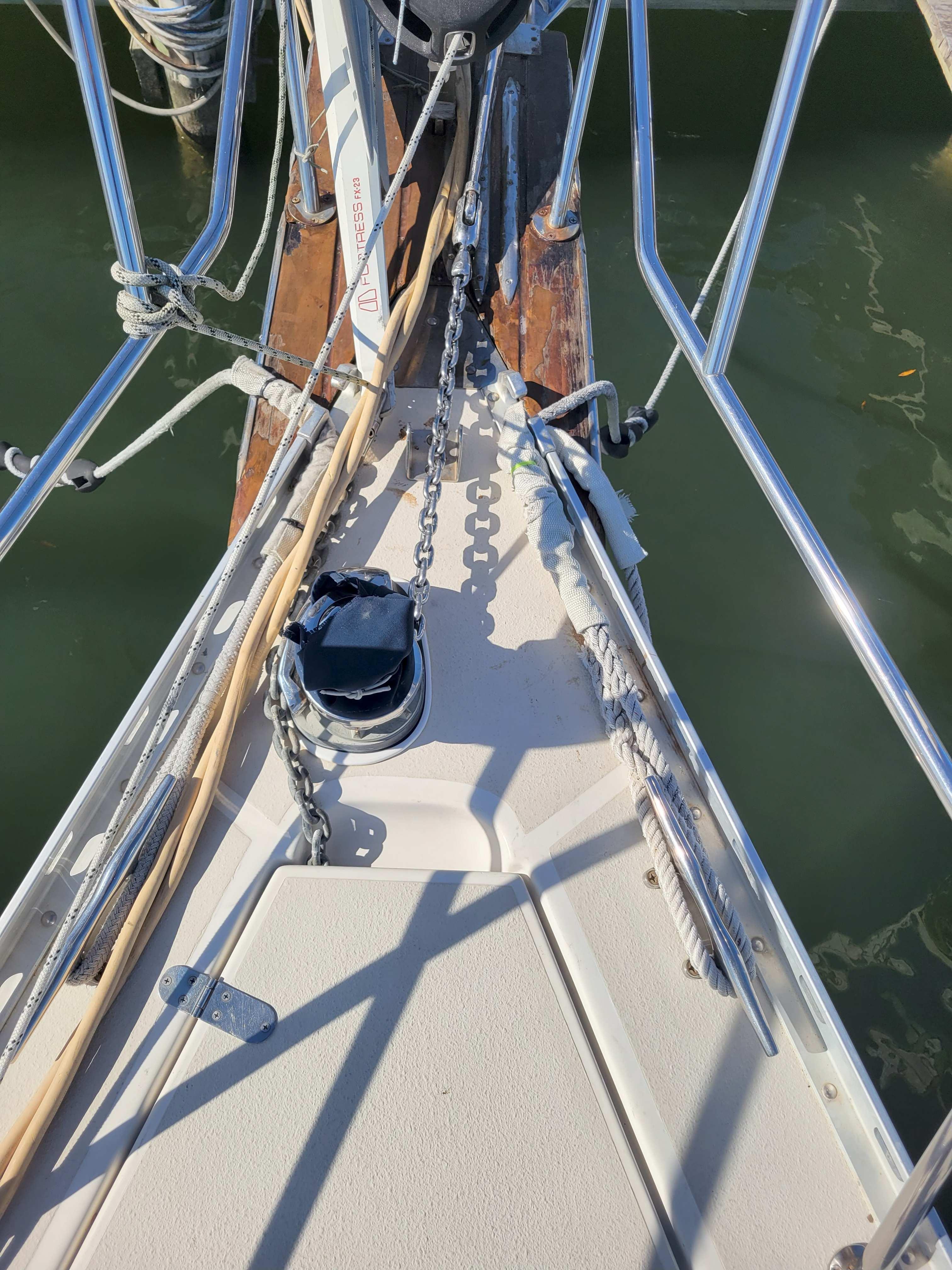 Bow of 2003 Caliber 40 LRC SE sailboat with anchor chain and ropes.