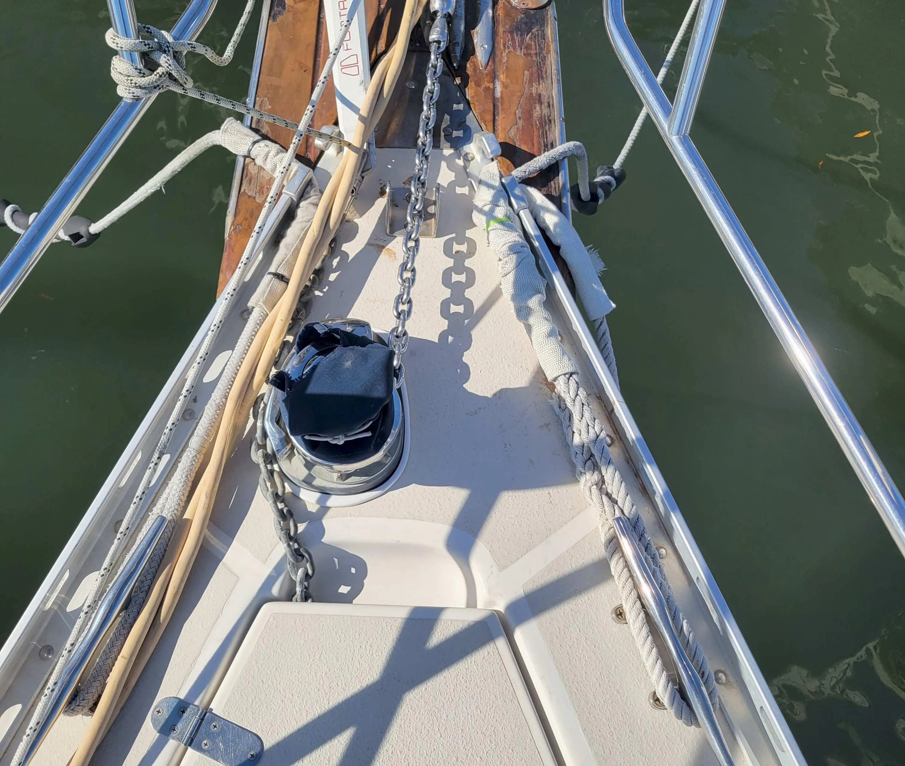 Bow of 2003 Caliber 40 LRC SE sailboat with anchor chain and ropes.