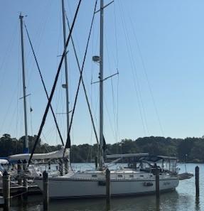 Sailboats docked at a marina, featuring a 2003 Caliber 40 LRC SE.