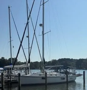 Sailboats docked at a marina, featuring a 2003 Caliber 40 LRC SE.