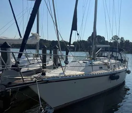 2003 Caliber 40 LRC SE sailboat docked at a marina, side view.