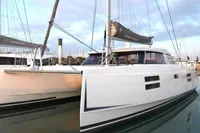 2018 Nautitech 40 Open catamaran docked in a marina, showcasing sleek design and modern features.