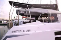 2018 Nautitech 40 Open catamaran docked at marina, showcasing sleek design and modern features.