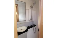 Bathroom interior of 2018 Nautitech 40 Open yacht with shower and sink.
