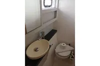 Bathroom interior of 2018 Nautitech 40 Open yacht with sink and toilet.