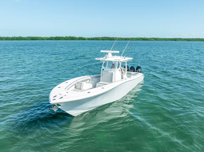  Yacht Photos Pics 2020 Yellowfin 34 boat cruising on clear blue water.