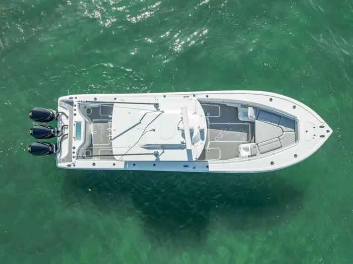  Yacht Photos Pics Aerial view of 2020 Yellowfin 34 boat on clear green water.